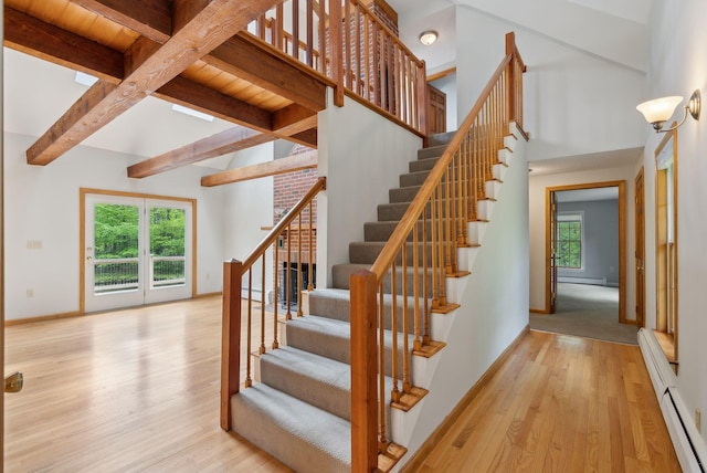 198 Range Rd, Cumberland, ME 04021 - stairs featuring wood finished floors, a baseboard heating unit, beam ceiling, a baseboard radiator, and baseboards
