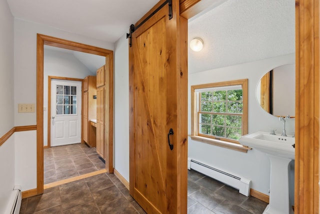 198 Range Rd, Cumberland, ME 04021 - bathroom featuring a baseboard heating unit, baseboards, and stone finish flooring