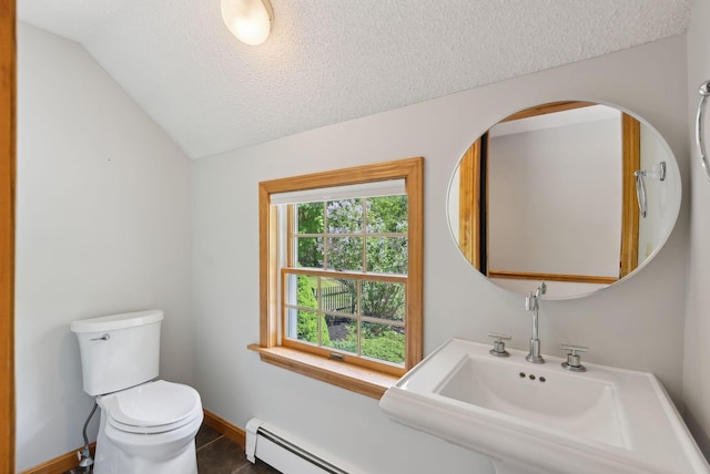 198 Range Rd, Cumberland, ME 04021 - half bathroom with toilet, a textured ceiling, lofted ceiling, baseboards, and a sink