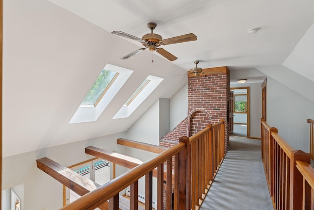 198 Range Rd, Cumberland, ME 04021 - hallway featuring an upstairs landing, a skylight, vaulted ceiling, and light colored carpet