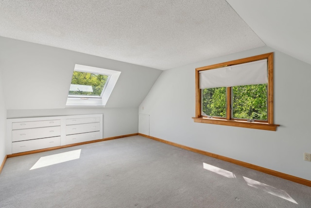 198 Range Rd, Cumberland, ME 04021 - bonus room with a skylight, lofted ceiling, healthy amount of natural light, carpet flooring, and a textured ceiling