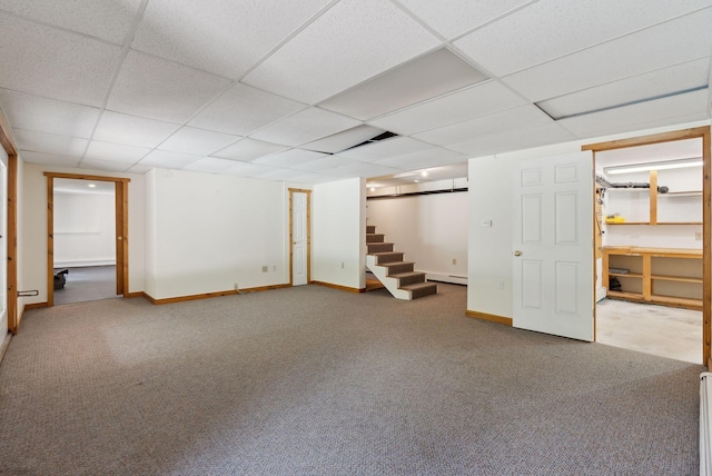 198 Range Rd, Cumberland, ME 04021 - finished below grade area with carpet floors, stairway, a baseboard heating unit, a paneled ceiling, and baseboards