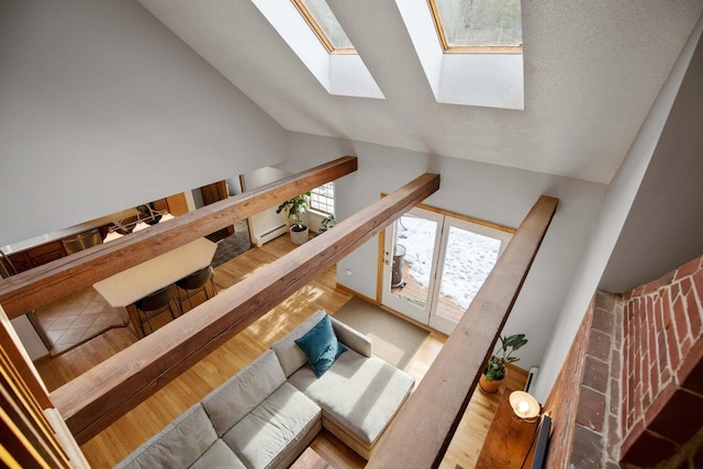 198 Range Rd, Cumberland, ME 04021 - staircase featuring a skylight, high vaulted ceiling, and wood finished floors