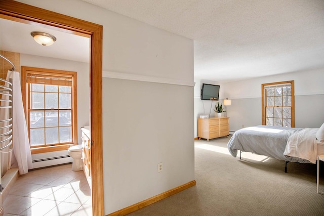 198 Range Rd, Cumberland, ME 04021 - bedroom featuring multiple windows, a baseboard heating unit, and baseboards