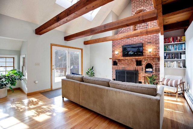 198 Range Rd, Cumberland, ME 04021 - living area featuring a fireplace, light wood-style floors, healthy amount of natural light, and a skylight