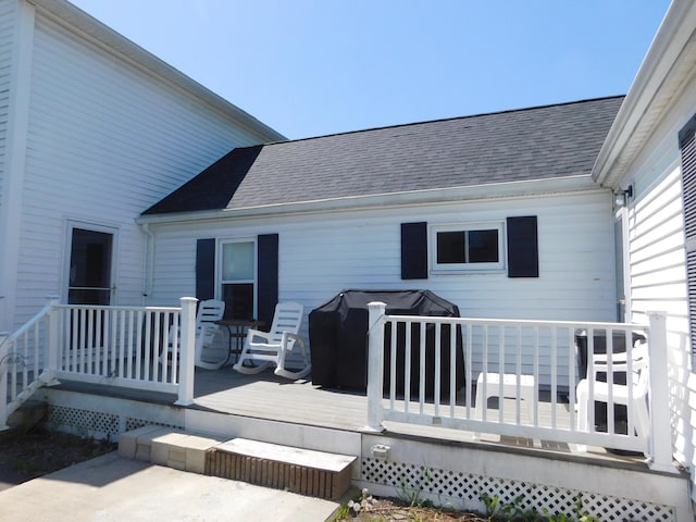56 Allen St, Bangor, ME 04401 - rear view of property with a shingled roof and a wooden deck