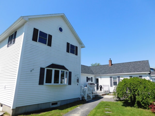 56 Allen St, Bangor, ME 04401 - rear view of house with a lawn and a wooden deck