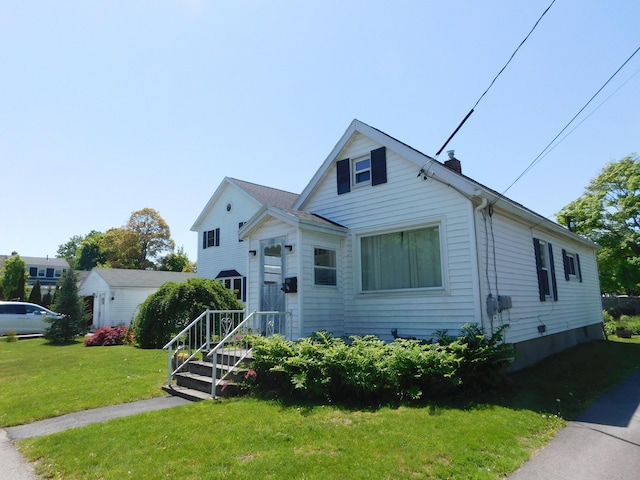 56 Allen St, Bangor, ME 04401 - view of front of property featuring a front yard and a chimney