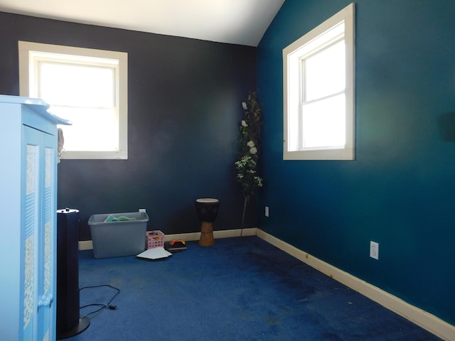 56 Allen St, Bangor, ME 04401 - carpeted empty room with baseboards and lofted ceiling