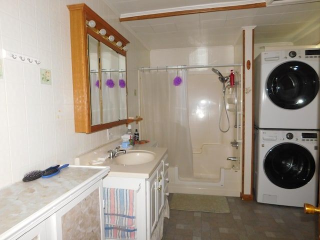 56 Allen St, Bangor, ME 04401 - full bath with stacked washing machine and dryer, vanity, and shower / tub combo