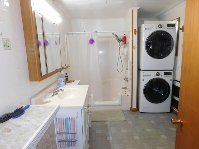 56 Allen St, Bangor, ME 04401 - bathroom with stacked washer and clothes dryer and vanity