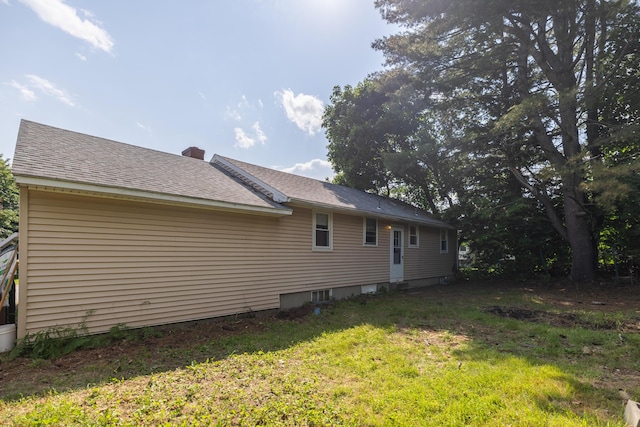 4 Scribner Cir, Lewiston, ME 04240 - rear view of house with a chimney, a yard, and a shingled roof