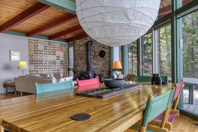 93 Eaton Point Rd, Deer Isle, ME 04627 - sunroom / solarium with a wood stove, wood finished floors, and wood ceiling with exposed beams