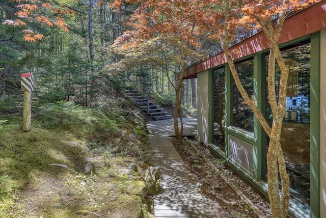 93 Eaton Point Rd, Deer Isle, ME 04627 - view of yard with stairs and a wooded view