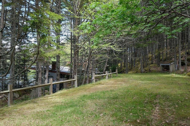 93 Eaton Point Rd, Deer Isle, ME 04627 - view of grassy yard with a wooded view