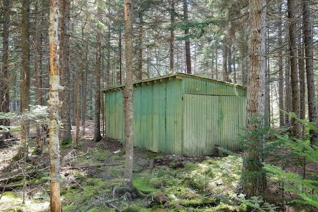 93 Eaton Point Rd, Deer Isle, ME 04627 - view of shed featuring a view of trees