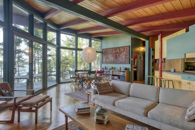 93 Eaton Point Rd, Deer Isle, ME 04627 - living area with wood finished floors, floor to ceiling windows, and wooden ceiling with exposed beams