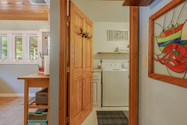38 Johnson Cove Rd, Otis, ME 04605 - laundry room with washer and clothes dryer and light tile patterned flooring