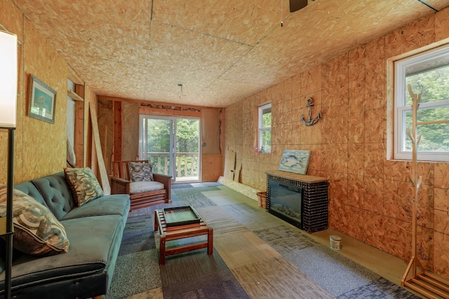 38 Johnson Cove Rd, Otis, ME 04605 - living area with a glass covered fireplace
