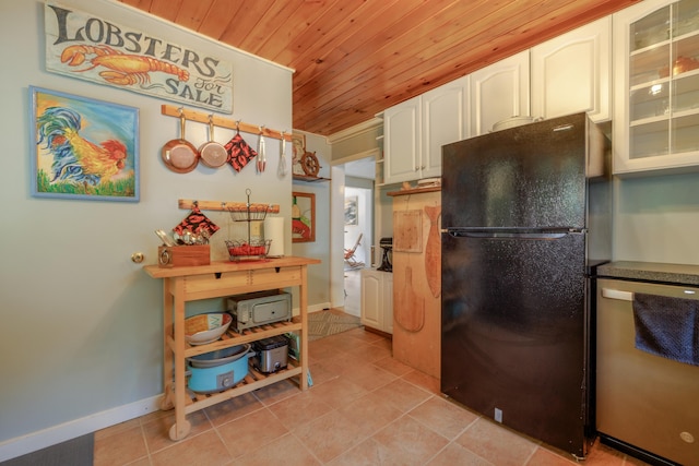 38 Johnson Cove Rd, Otis, ME 04605 - kitchen with freestanding refrigerator, wooden ceiling, dishwasher, light tile patterned flooring, and white cabinets