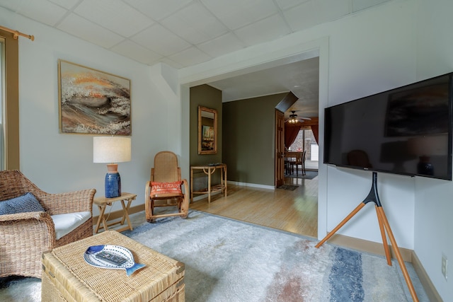 38 Johnson Cove Rd, Otis, ME 04605 - living area with a drop ceiling, a ceiling fan, and wood finished floors