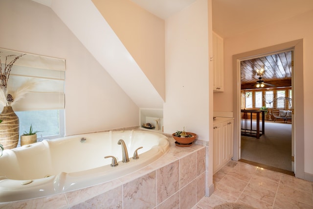 38 Johnson Cove Rd, Otis, ME 04605 - full bathroom with a jetted tub and tile patterned floors