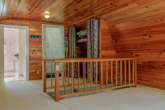 38 Johnson Cove Rd, Otis, ME 04605 - corridor with lofted ceiling, carpet floors, wooden walls, and wood ceiling