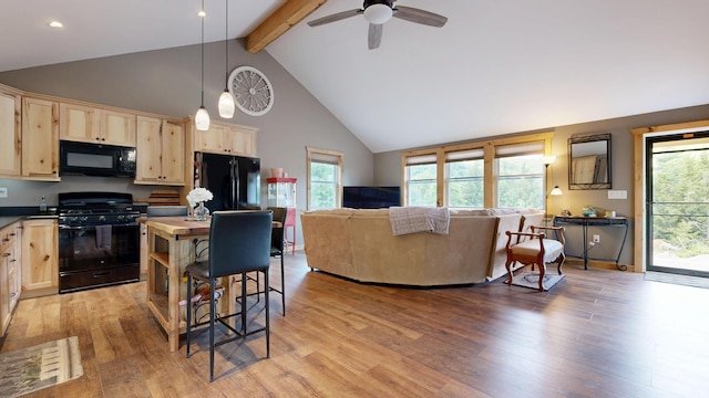 580 Spring St, Brownfield, ME 04010 - kitchen featuring black appliances, light brown cabinets, beamed ceiling, healthy amount of natural light, and light wood-style floors