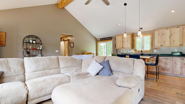 580 Spring St, Brownfield, ME 04010 - living area featuring beam ceiling, high vaulted ceiling, light wood-style floors, a barn door, and recessed lighting