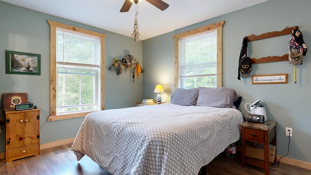 580 Spring St, Brownfield, ME 04010 - bedroom featuring multiple windows and wood finished floors