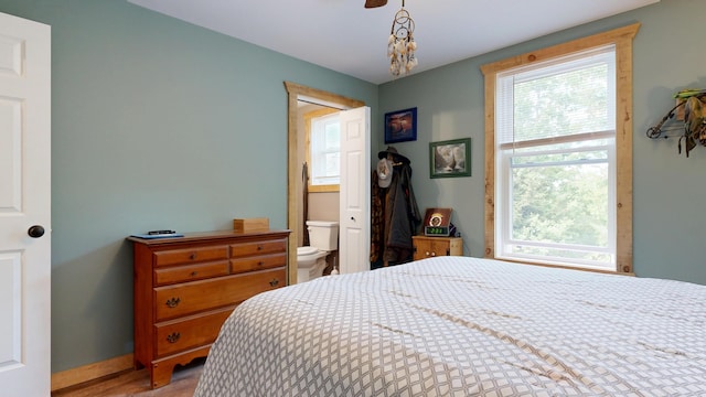 580 Spring St, Brownfield, ME 04010 - bedroom with ensuite bathroom and baseboards