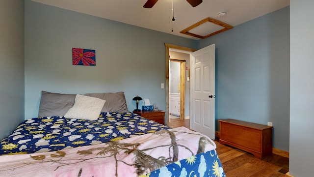 580 Spring St, Brownfield, ME 04010 - bedroom with attic access, wood finished floors, ceiling fan, and baseboards
