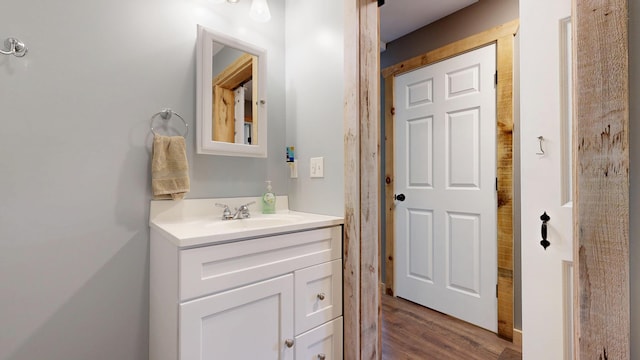 580 Spring St, Brownfield, ME 04010 - bathroom featuring vanity and wood finished floors