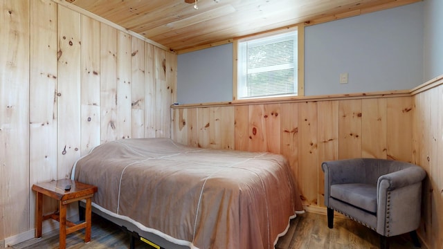 580 Spring St, Brownfield, ME 04010 - bedroom featuring wood walls, wood finished floors, and wood ceiling