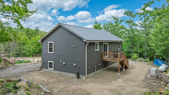580 Spring St, Brownfield, ME 04010 - back of property featuring a wooden deck and metal roof