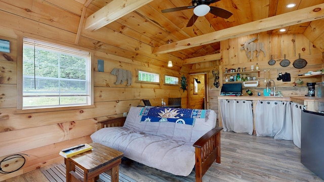 580 Spring St, Brownfield, ME 04010 - living room with wooden walls, wood ceiling, plenty of natural light, light wood-style floors, and a ceiling fan