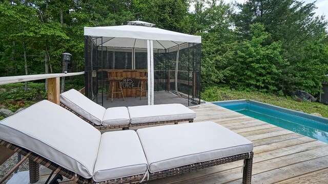 580 Spring St, Brownfield, ME 04010 - deck featuring an outdoor pool and view of scattered trees