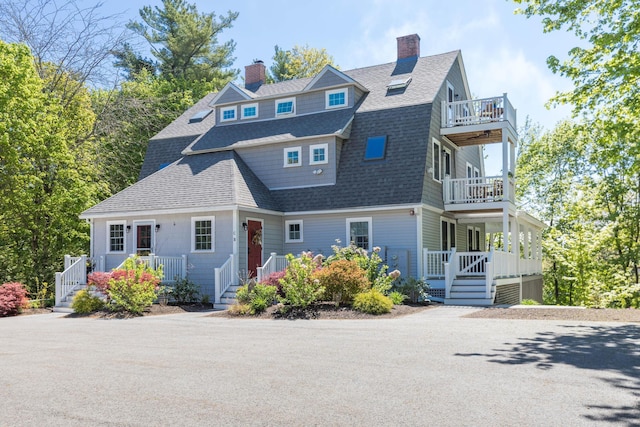 21 Fernald Ave Unit B, York, ME 03909 - shingle-style home with a balcony, a chimney, a shingled roof, and covered porch