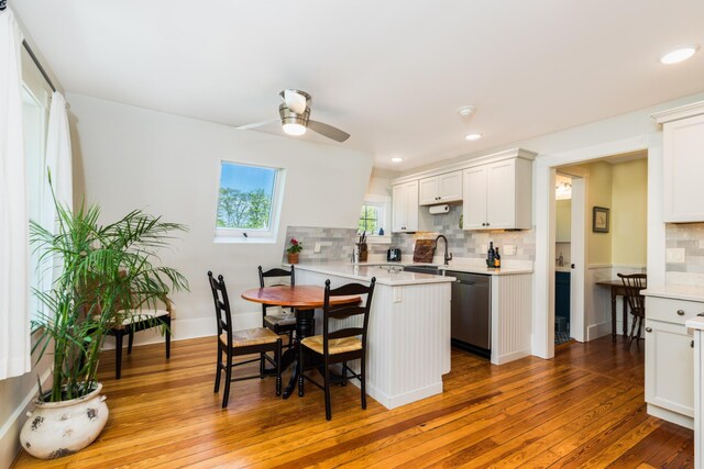 21 Fernald Ave Unit B, York, ME 03909 - kitchen featuring dishwasher, a sink, a breakfast bar, hardwood / wood-style flooring, and recessed lighting