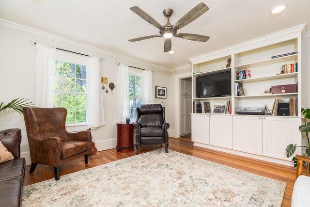 21 Fernald Ave Unit B, York, ME 03909 - sitting room featuring wood finished floors, crown molding, ceiling fan, and baseboards