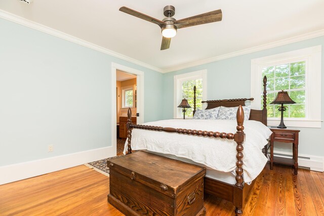 21 Fernald Ave Unit B, York, ME 03909 - bedroom featuring a baseboard radiator, crown molding, wood finished floors, baseboards, and a ceiling fan