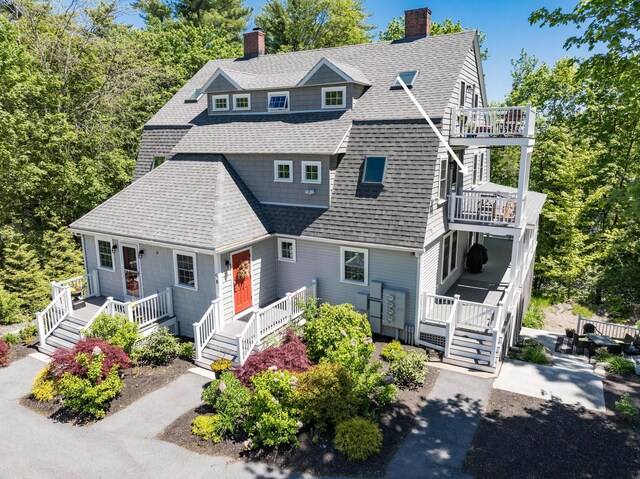 21 Fernald Ave Unit B, York, ME 03909 - view of front of house with a balcony, a chimney, and a shingled roof