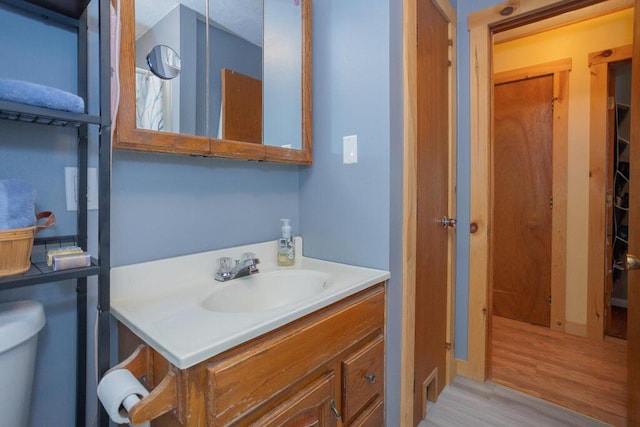 38 Greenridge Way, Jay, ME 04239 - bathroom with vanity, wood finished floors, and toilet