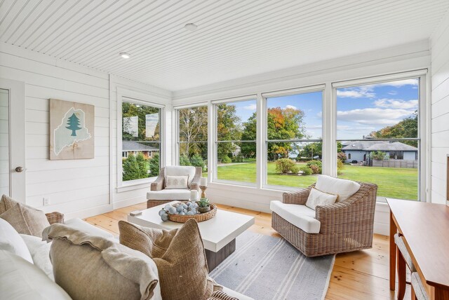239A Foreside Rd ., Unit Falmouth, ME 04105 - sunroom / solarium with an outdoor living space, plenty of natural light, wood finished floors, and wooden walls