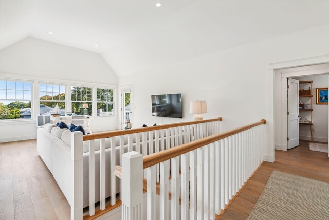 239A Foreside Rd ., Unit Falmouth, ME 04105 - living room with wood finished floors, lofted ceiling, recessed lighting, and baseboards