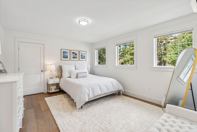 239A Foreside Rd ., Unit Falmouth, ME 04105 - bedroom featuring dark wood-type flooring and baseboards