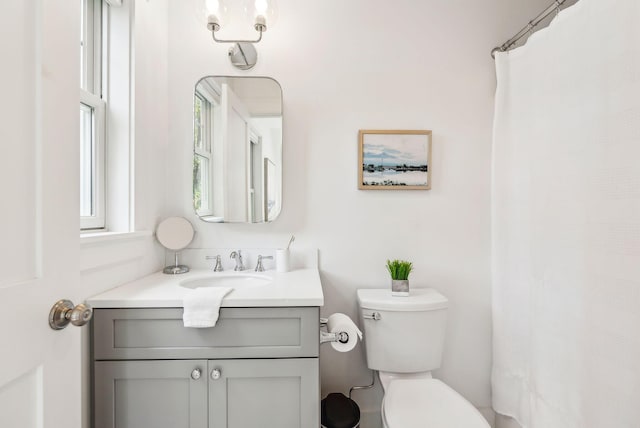 239A Foreside Rd ., Unit Falmouth, ME 04105 - bathroom featuring toilet, vanity, and a shower with curtain
