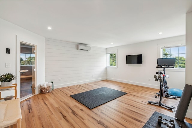 239A Foreside Rd ., Unit Falmouth, ME 04105 - exercise room featuring a wall unit AC, wood finished floors, baseboards, and recessed lighting