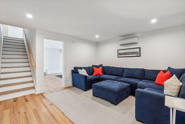 239A Foreside Rd ., Unit Falmouth, ME 04105 - living area with an AC wall unit, light wood-style flooring, stairs, and recessed lighting