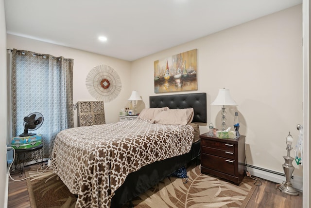 128 Alfred St, Biddeford, ME 04005 - bedroom with wood finished floors, a baseboard radiator, and baseboards